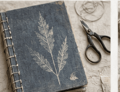 A blue botanical journal with scissors and loose thread